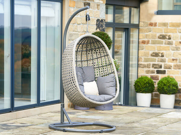 Egg chair with grey cushions