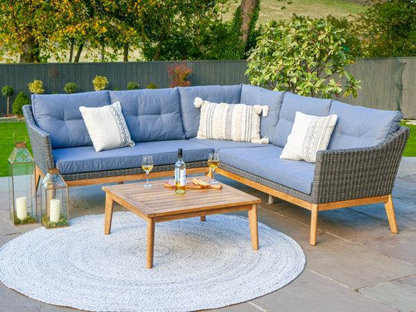 Outdoor sofa with blue cushions